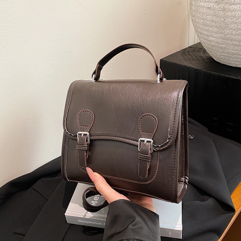 Colegio retro coreano doble hebilla estilo británico 2024 literatura y arte ocio de gran capacidad de moda textura mochila de hombro