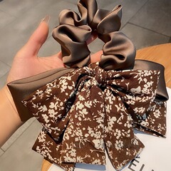 韓国の東大門の新型の巨大な蝶結びの花のリボンの女性の高級感の小さい大衆の後頭部の紐の髪飾り