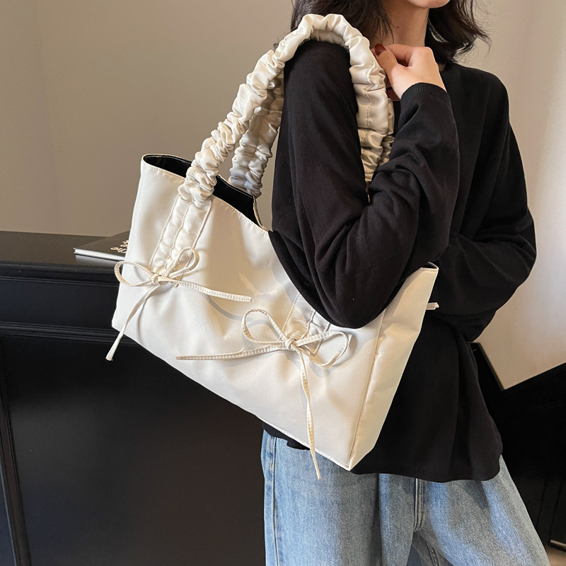 Bolsos de arco de textura de alta calidad, bolsas de nylon de alta capacidad, damas 2025, bolsas de moda, bolsas de nylon casuales de gran capacidad