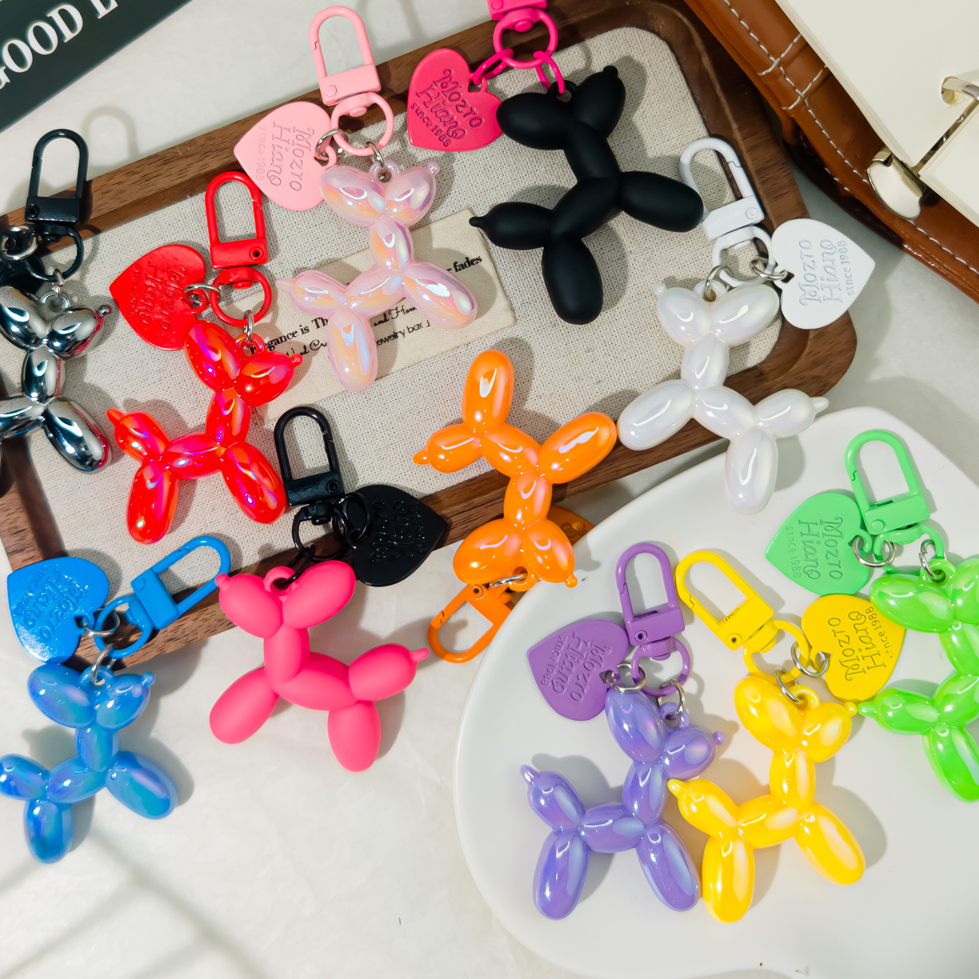 Botón de color M42 globo láser perro ins viento llavero colgante color caramelo accesorios joyería bolsos DIY bolsos de mujer