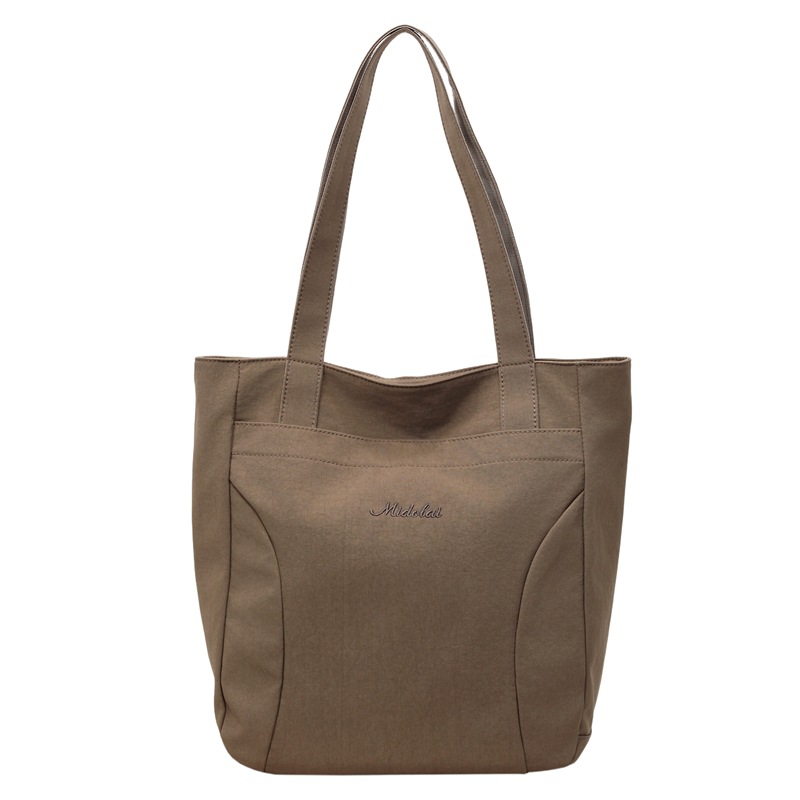 Bolsa de lona para mujeres nuevo estilo japonés retro simple de color sólido gran capacidad bolsa de transporte universal mochila universitaria