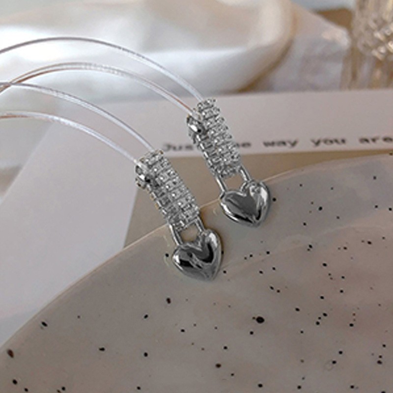 Anillo de metal francés aretes de anillo simple aretes de aretes nuevos estilos de estilo estilo estilo estilo de diseño de nicho temperamento único aretes de mujer cara pequeña