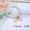 Human head from pearl, keychain