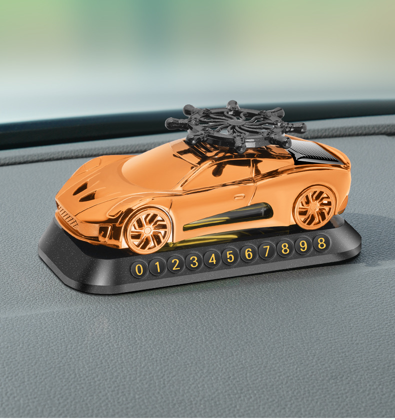 New solar helmsman car model aromatherapy ornaments car perfume three-in-one multifunctional car parking card car