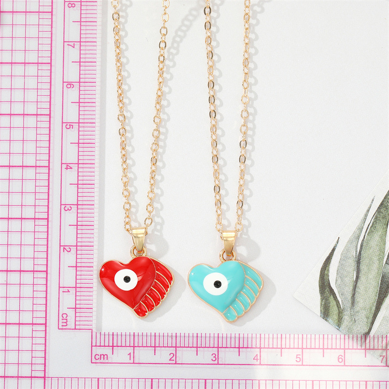 Fashion Alloy Drip Oil Color Eyes Wings Heart Necklace Peach Heart Devil Eye Necklace display picture 3