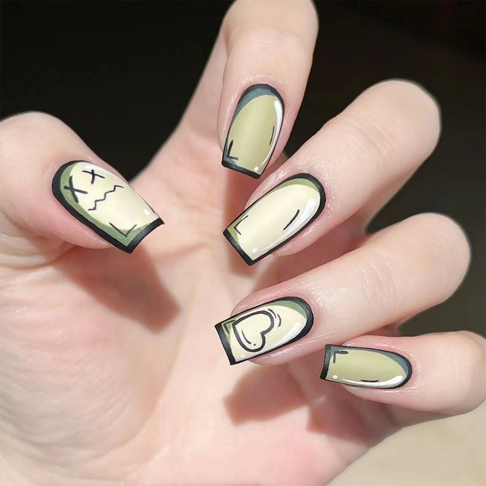 Comercio exterior oscuro marea fresca dibujos animados manicuras interesantes X ojos fruncidos dibujados a mano para usar uñas 24 piezas de parche de uñas personales image 1