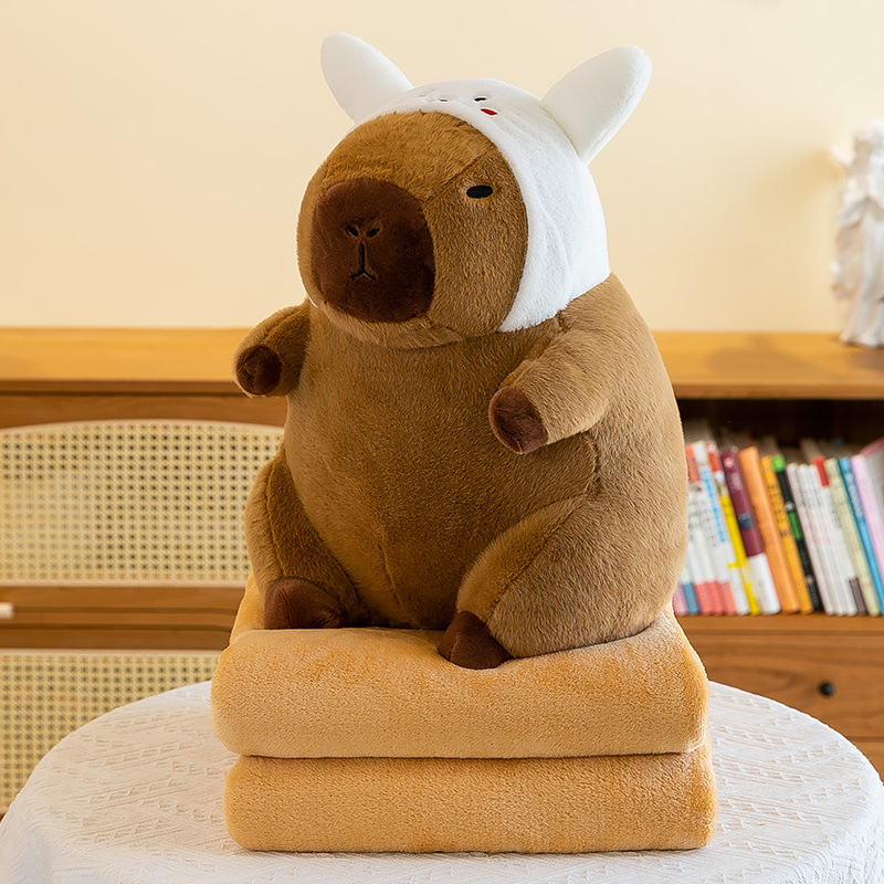 Caricatura capibara almohada manta dos en uno Carpibara cojín aire acondicionado es de doble uso niños siesta manta regalo