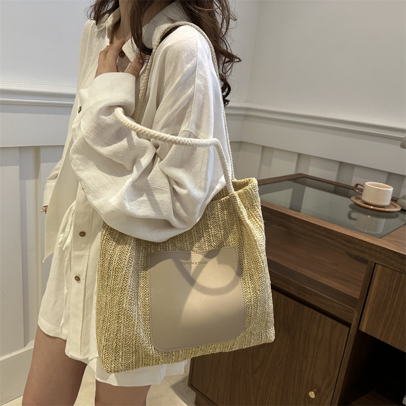 Bolsa de tejido de gran capacidad para mujeres 2024 nueva moda bolso de hombro de aire extranjero de alta calidad sensación de tela de paja bolso de mujer bolso especial