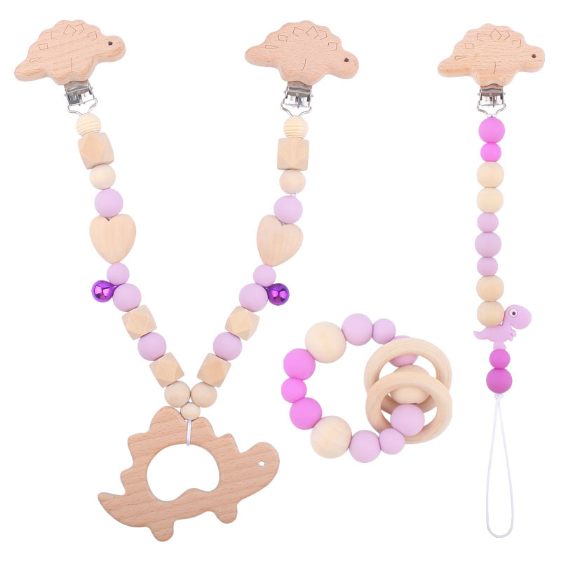Suministros para bebés pulsera de silicona molar de juguete para niños Cadena de cochecito de dinosaurio de tres piezas creativa pequeña campana colgante