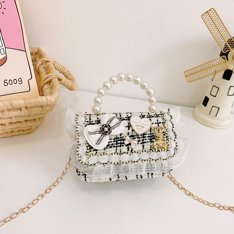 Bolso infantil, lindos arcos de perlas, bolso de mochila para niños, estilo coreano de moda, bolso de hombro para hombres y mujeres.