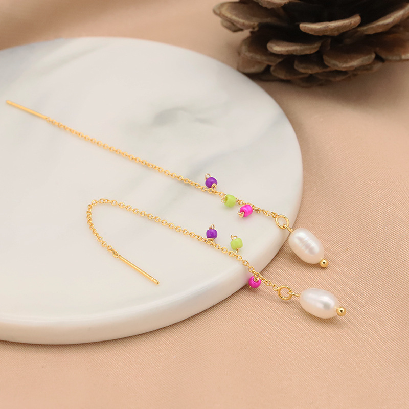 Pendientes de perlas naturales de agua dulce pendientes femeninos nicho de alto grado pendientes anillo de joyería original hecho a mano transfronteriza al por mayor