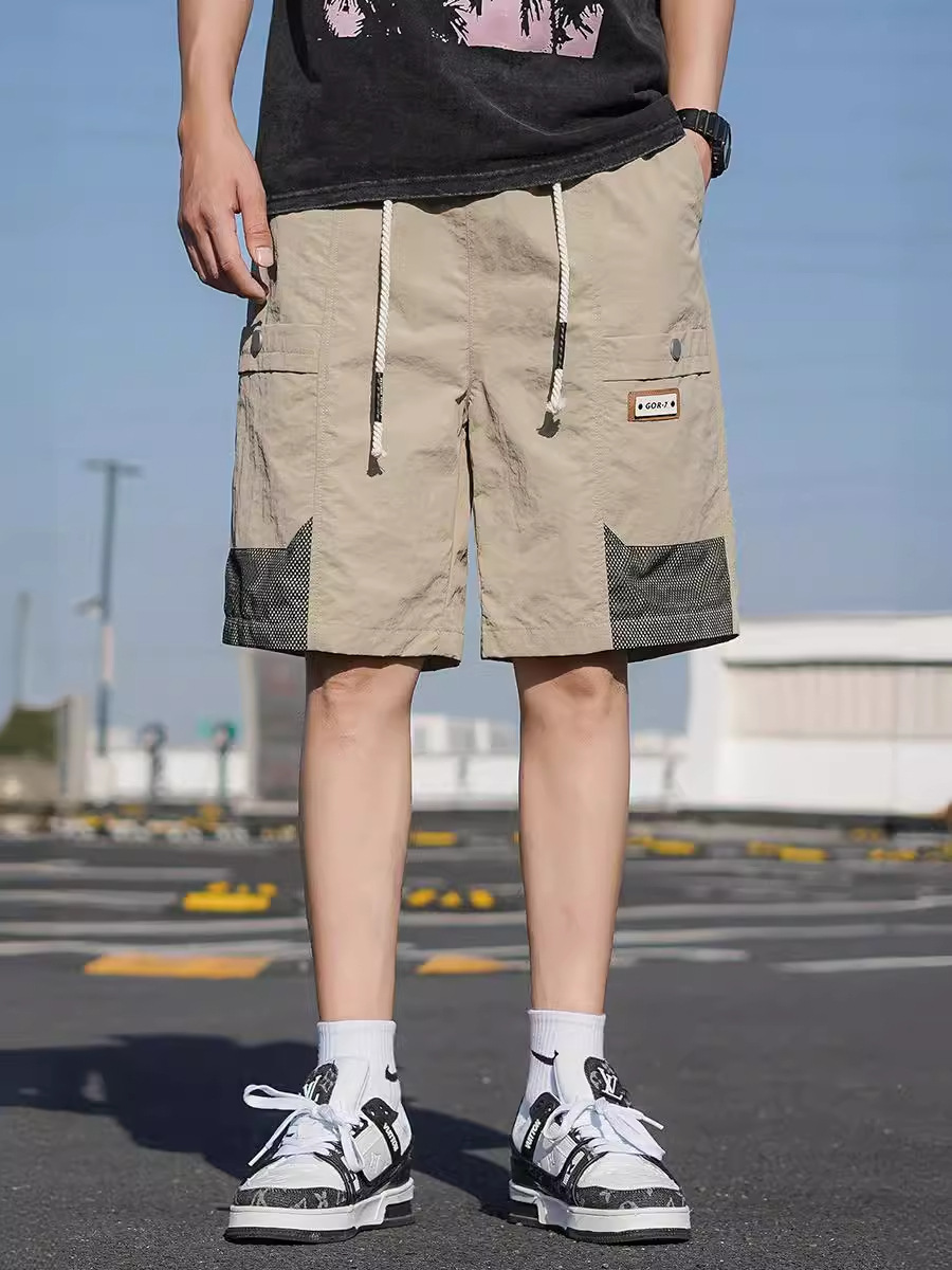 Pantalones cortos de seda de hielo de moda de verano para hombres. Pantalones de aire secos. Pantalones de cinco puntos. Pantalones de hombre grandes.