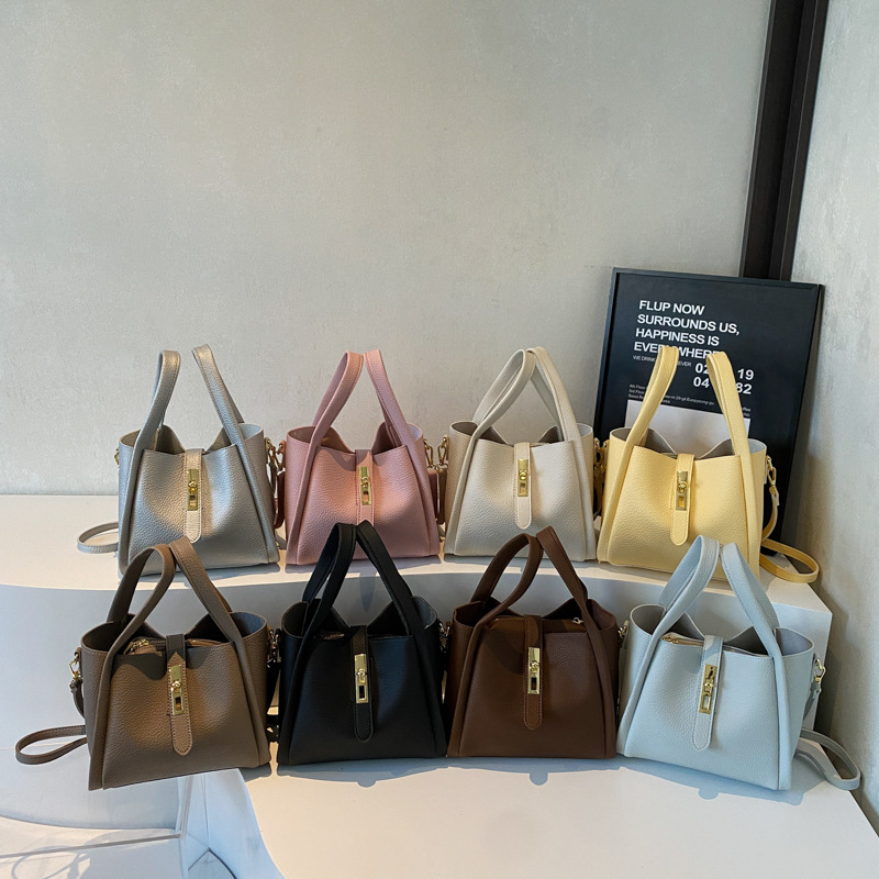 Cestas de verduras bolsas de mano mujeres 2025 nuevo retro moda bolsas de cubo de alta sensación nicho hombro bolsas de mujer