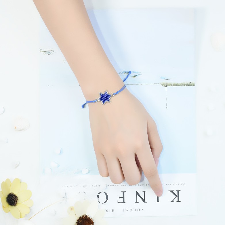 Nueva pulsera de las mujeres europeas y americanas importadas granos de arroz DIY hecho a mano original estrella tejida pulsera de la joyería ventas directas de la fábrica