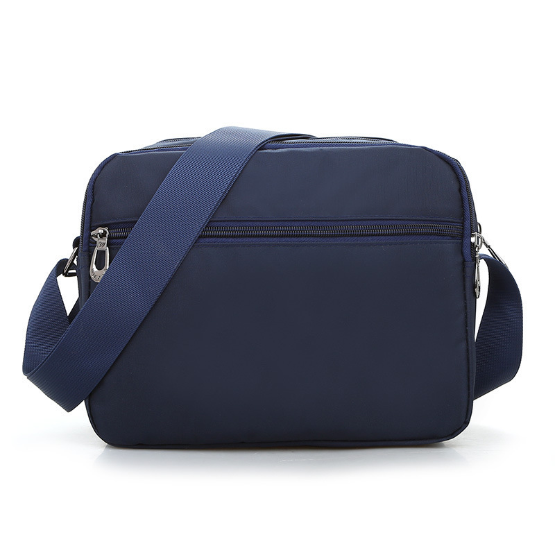 Bolso bandolera unisex de nailon de nuevo estilo, color liso, moderno, impermeable, ligero, para viaje, modelo unisex.