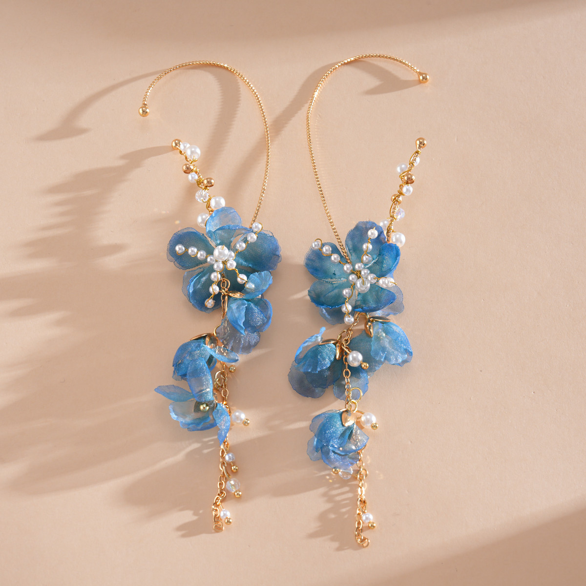 Europa y los Estados Unidos super inmortal vidrio de perla chiffon flor de bordillo personalidad dulce aretes de aretes de vacaciones de mar aretes de viento