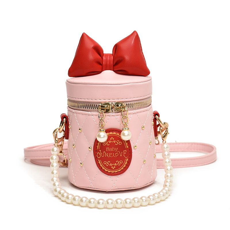 Bolso para niños coreano 2025, nuevo lindo bolso de arco, bolso de cubo, bolso de hombro de cadena de perlas de chicas