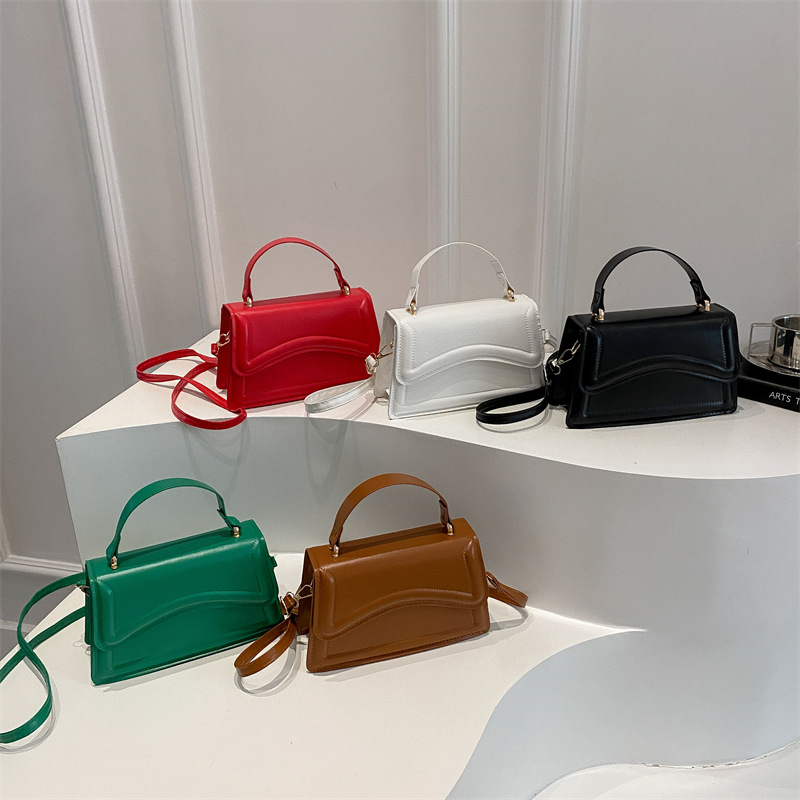 Texturas de moda en estilo de estilo de viaje ocio personalidad de primavera 2025 nuevo bolso de mano minimalista nicho bolso de mochila