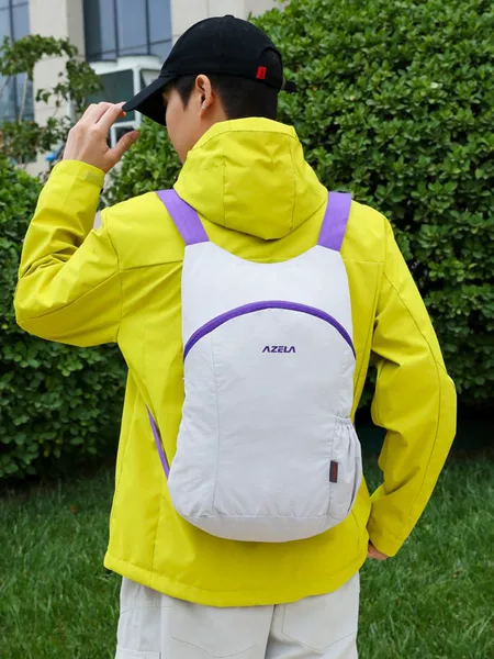 Stylish and lightweight color-blocked backpack, suitable for travel, outdoor activities, and hiking; a versatile and water-resistant bag