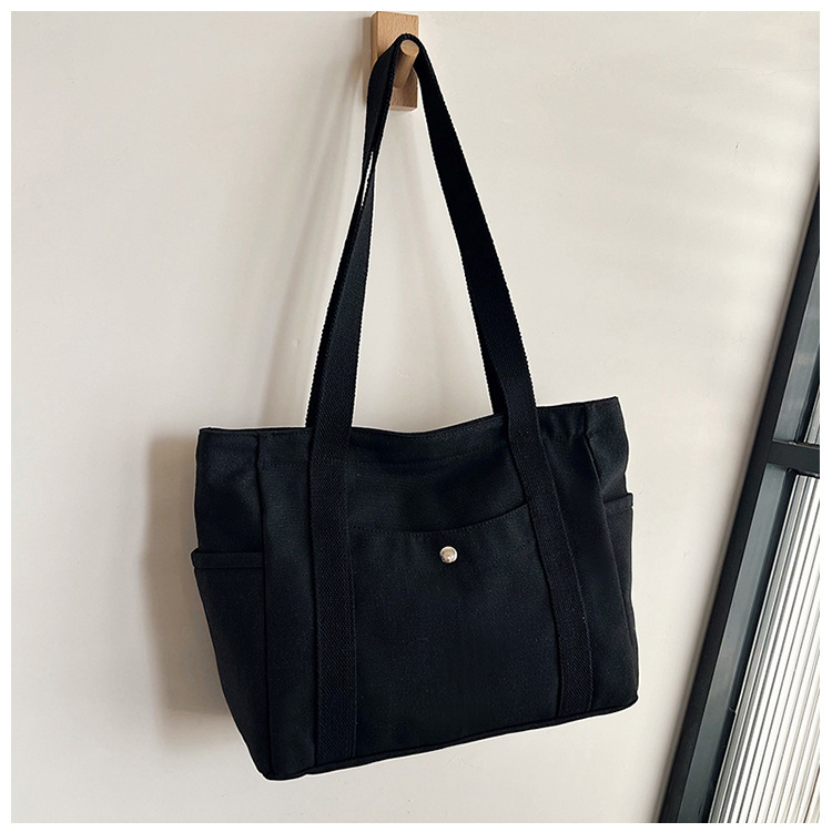 Wholesale of new women's single-shoulder bags, cross-border simple and casual canvas bags, Korean version LOGO printed commuter tote bags undefined