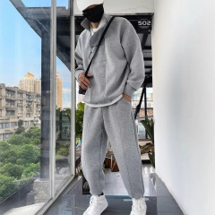 スポーツスーツの男性秋冬の厚手のファッション服のスーツの男性のゆったりとした半開きのダブルファスナーのスポーツスーツの卸売り