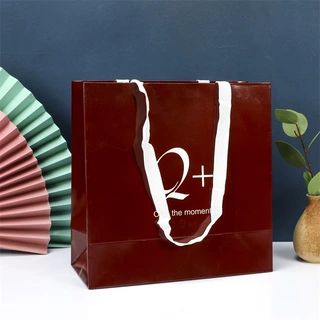 高档特种纸袋服装店购物手拎礼品包装袋 可加印logo手提 袋子批发