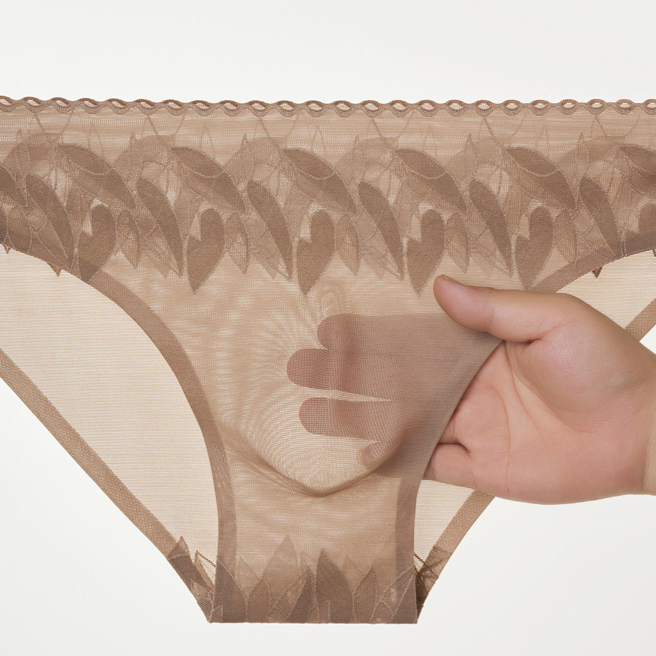 Nuevas calzoncillos de hombre elásticos de encaje 3D bolsas convexas estereoscópicas calzoncillos de hombre sin marcas