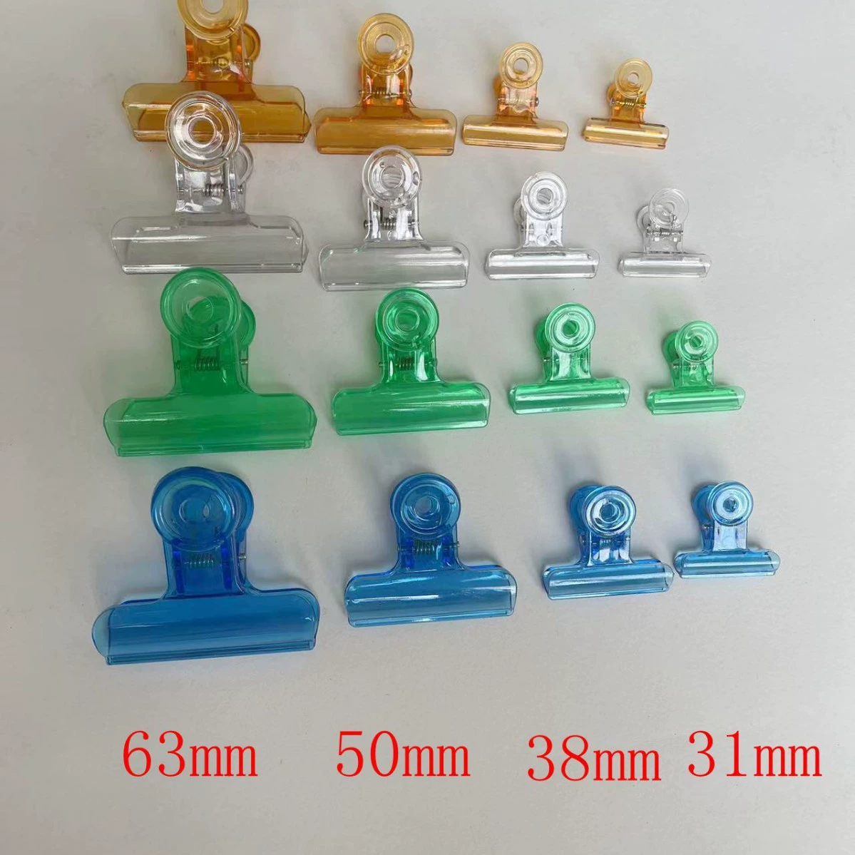 Поставка красочного пластикового зажима для купюр, пружинного зажима, прозрачного зажима для купюр, 31 мм, 38 мм, 50 мм, 63 мм, пластикового зажима