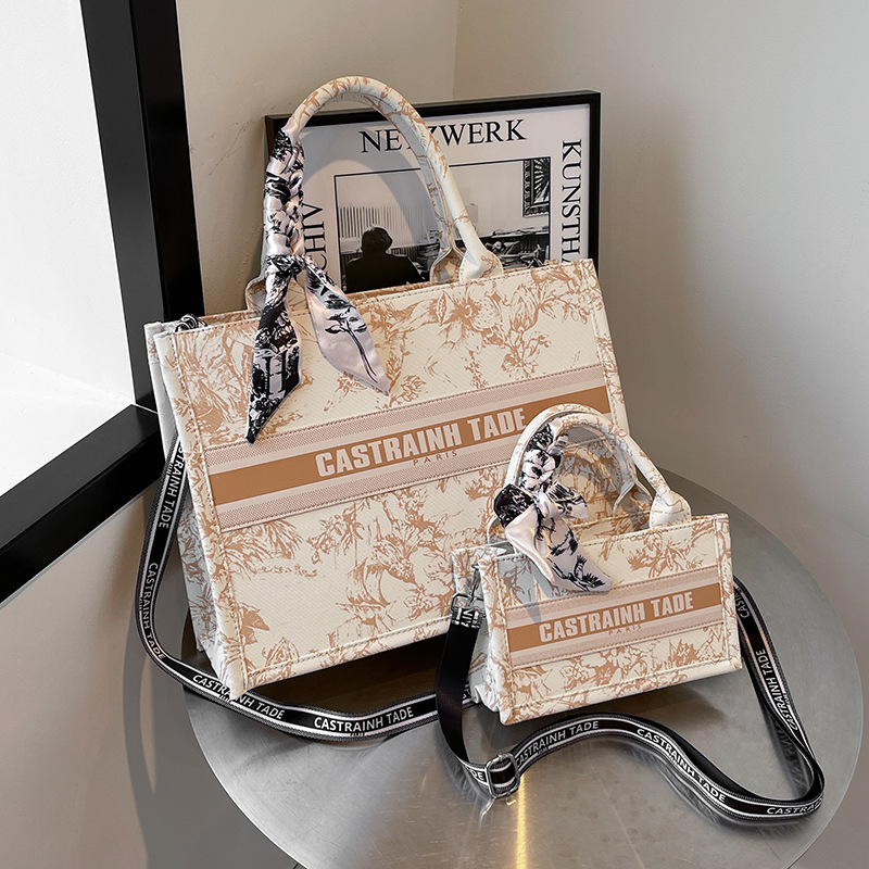 Bolsos de lona transfronterizos bolsos de mujer 2025 nueva moda retro letras impresas bolsos de hombro de gran capacidad