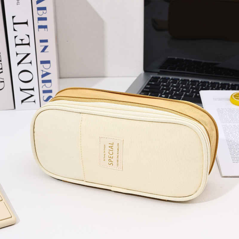 Bolso de lápices retráctil de lona de color de contraste de estilo explosivo transfronterizo Bolso de papelería de gran capacidad con doble cremallera simple multifuncional para estudiantes