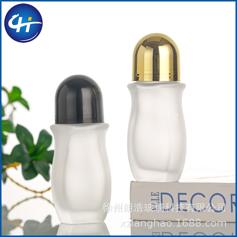 Venta al por mayor de vidrio transparente 50ml botella de bola de rodillo 30ml aceite esencial aceite de medicina cuerpo masaje botella de cuentas dolor botella grande