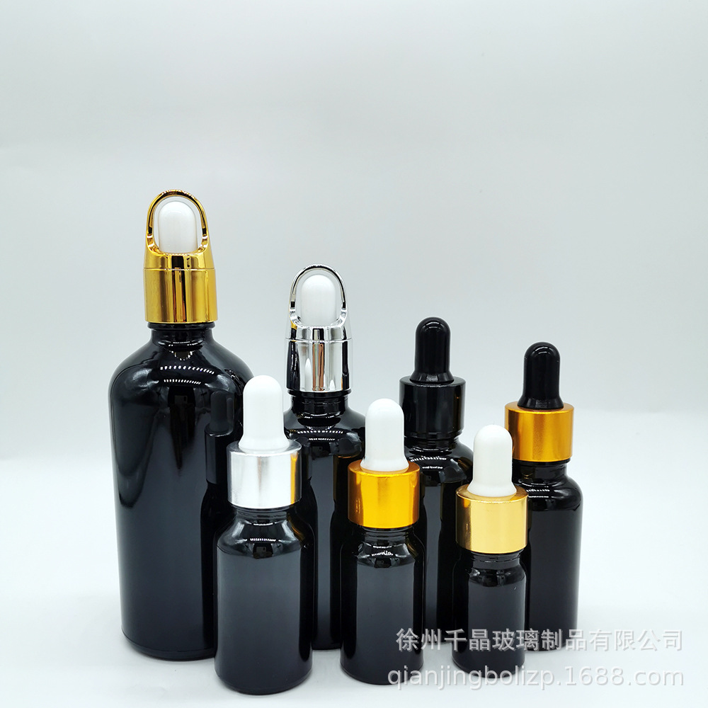 En stock botella de aceite esencial de vidrio negro brillante 5mL-100mL materia prima cosméticos negros sub-botella sombreado botella cuentagotas de cabeza de goma