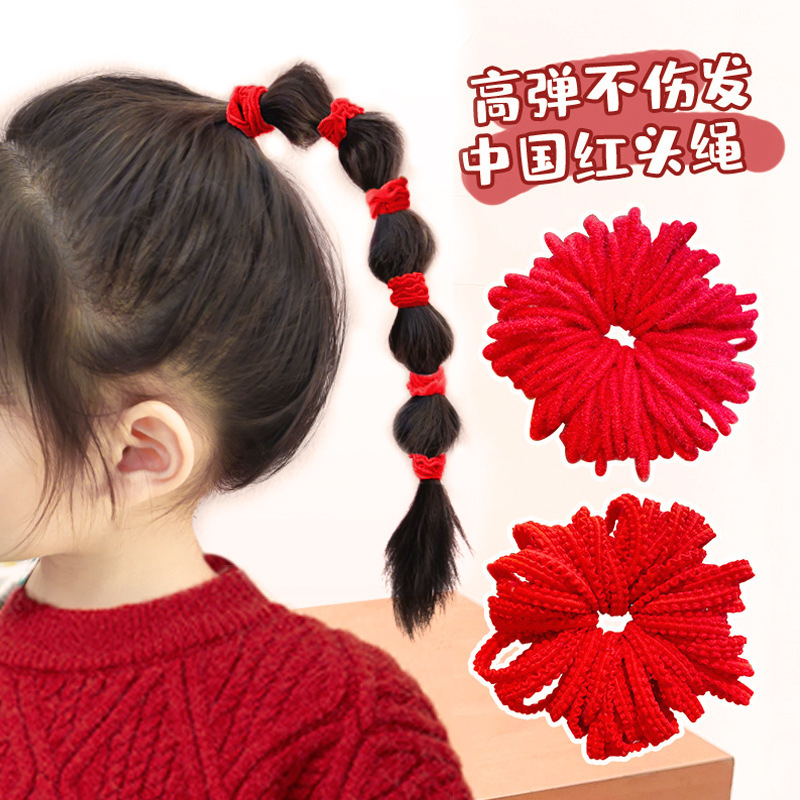 国慶節の子供の赤いひもは髪の筋を刺します。女の子は髪のゴムの髪飾りを傷つけません。|undefined