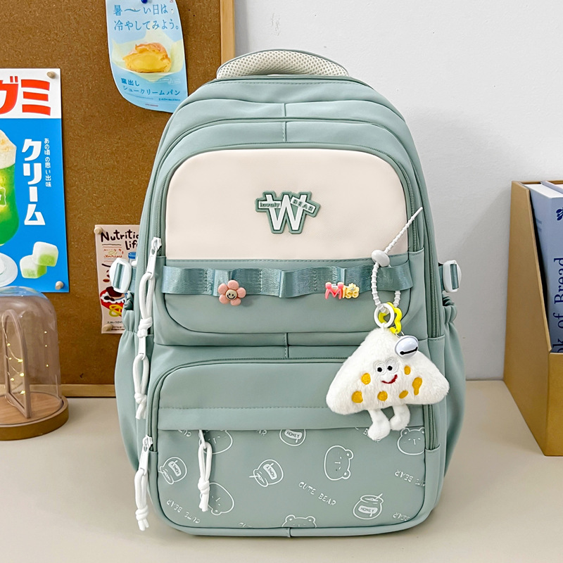 Nueva mochila de hombro simple letras negras con lindos colgantes mochila de carga mochila de gran capacidad