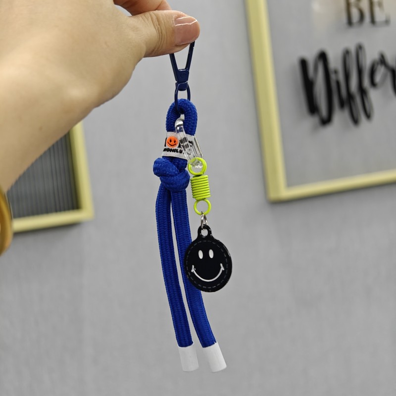 Sonriente cuerda de trenzado llaves de coche bolsos colgantes bolsos accesorios de ropa en caso de teléfono móvil cuerda de color