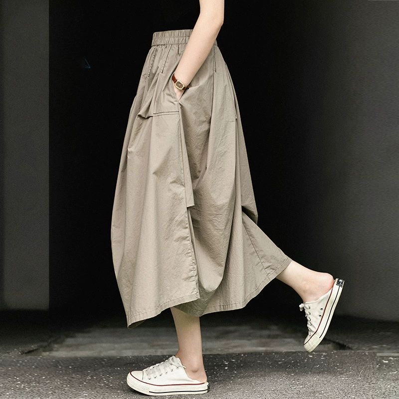 Оригинальная экспортная повседневная летняя свободная утягивающая однотонная юбка средней длины с высокой талией, универсальная лоскутная юбка неправильной формы средней длины