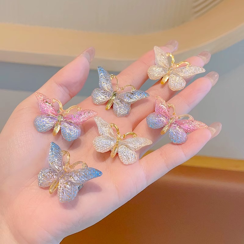 Estilo explosivo Super Fairy Symphony Horquilla de mariposa tridimensional Clip de pelo roto femenino Tocado Clip de pico de pato Horquilla para niños con sentido avanzado