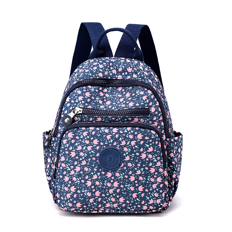 Nuevo estilo coreano mochila de mujer de moda de mediana edad y anciano madre viaje pequeña mochila de nylon mochila casual al por mayor