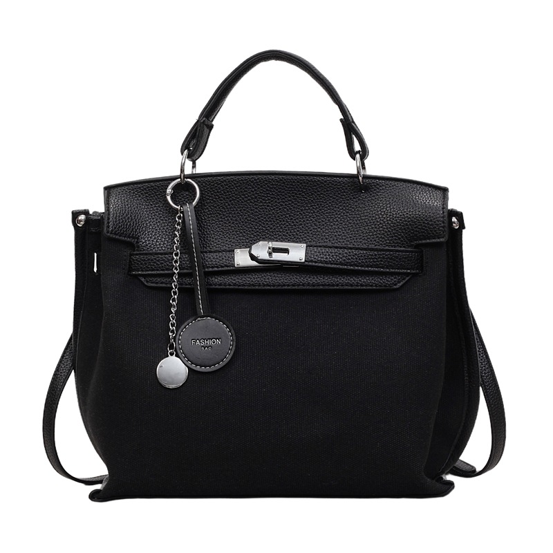 Bolso para mujeres 2026 nuevo cross-border lienzo empalme color contraste bolso de mano alta sensación retro mochila de hombro