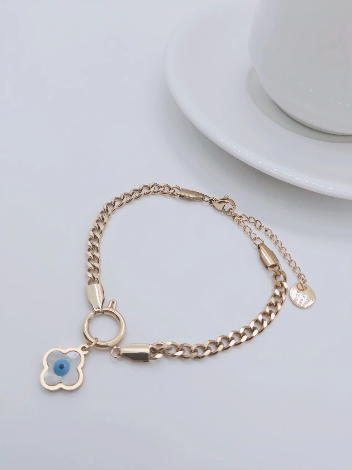 Fashion Gold-plated Titanium Steel Devil's Eye Four-leaf Flower Simple Bracelet Wholesale display picture 1