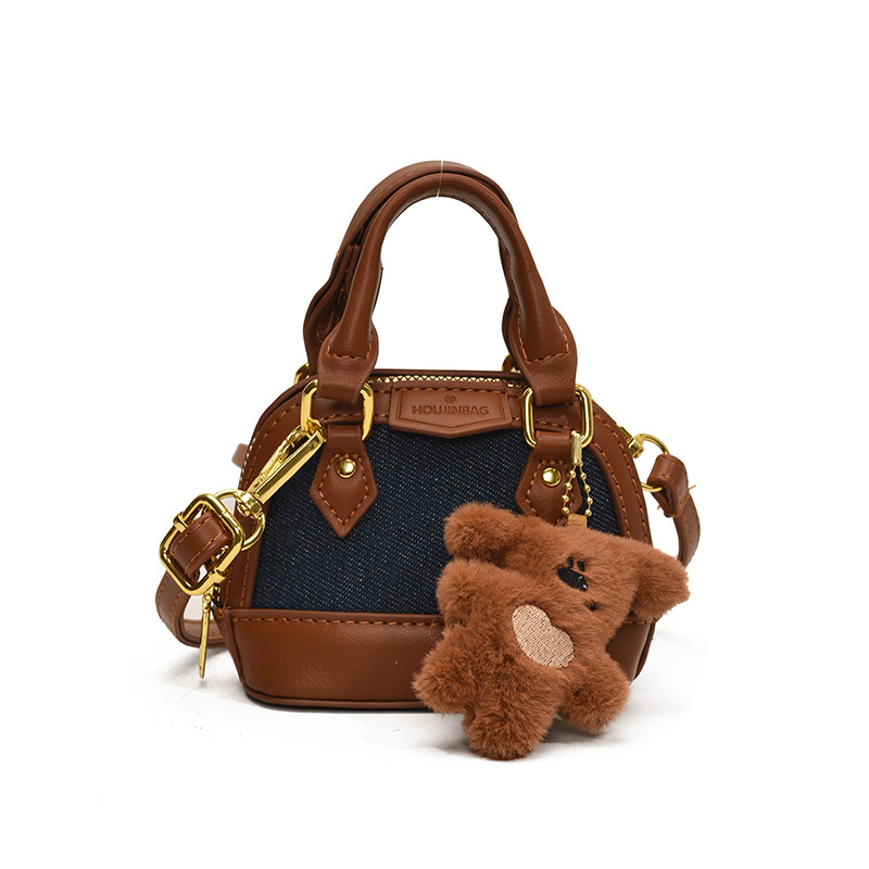 Mochila de moda de leopardo para niñas, mini bolso de concha portátil para bebés, 2025 nuevo bolso de comercio exterior para niños