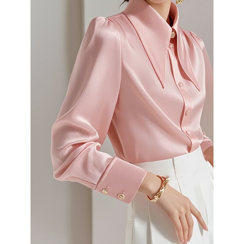 This year, the trend is for beautiful, uniquely stylish, and subtly luxurious blouses that exude a high-end feel. These pink acetate satin shirts are perfect for autumn