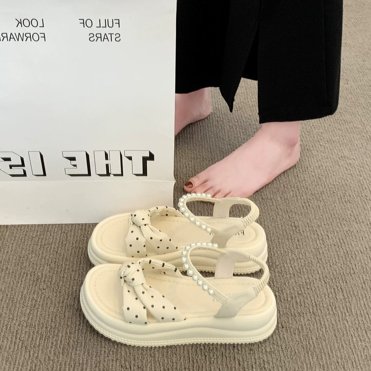 Punto de ondas de alto nivel de sensación de sandálias de suela gruesa para mujeres 2026 nuevo verano suave estilo francés de hadas zapatos de perlas romanas