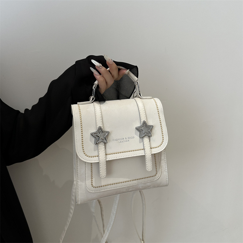 Mochila pequeña 2024 nuevo estilo de diseño de moda nicho de viaje bolsas escolares ligeras para mujeres ins para salir mochila pequeña