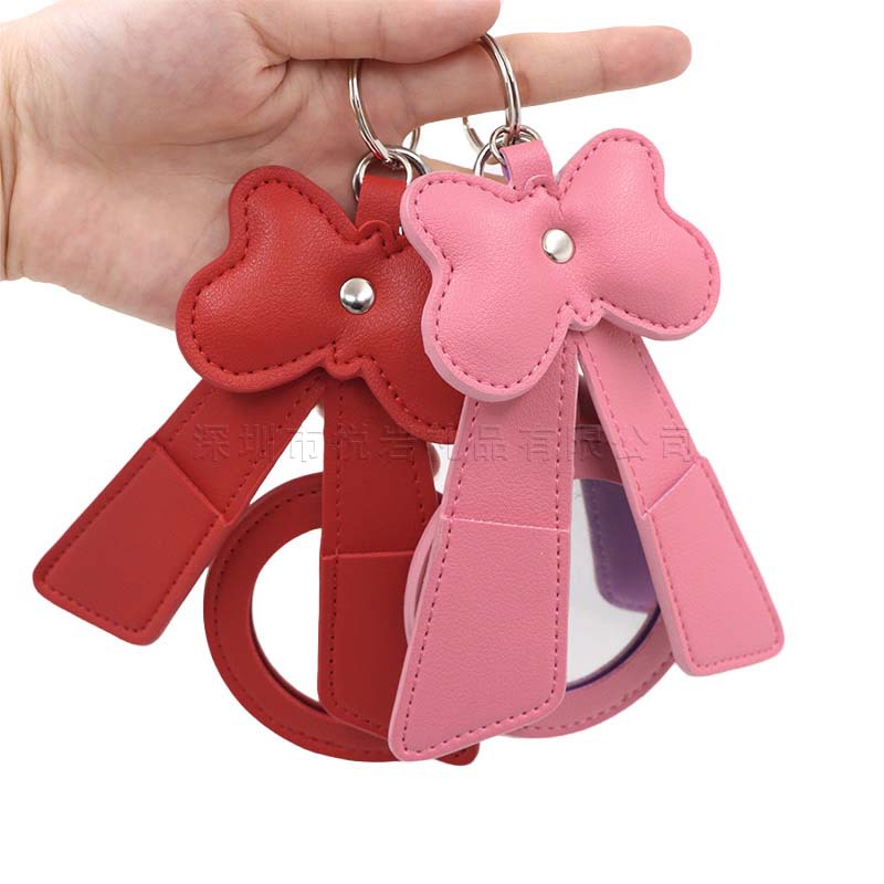 Cross-border bestseller: Cute bow-shaped makeup mirror keychain, portable makeup mirror pendant, lipstick storage bag