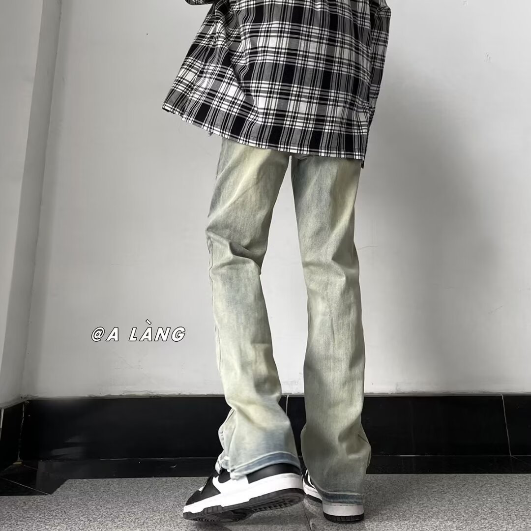 Primavera y verano lavados y desgastados pantalones vaqueros delgados de barro amarillo, pies pequeños de moda para hombres, pantalones de calle americanos 2024