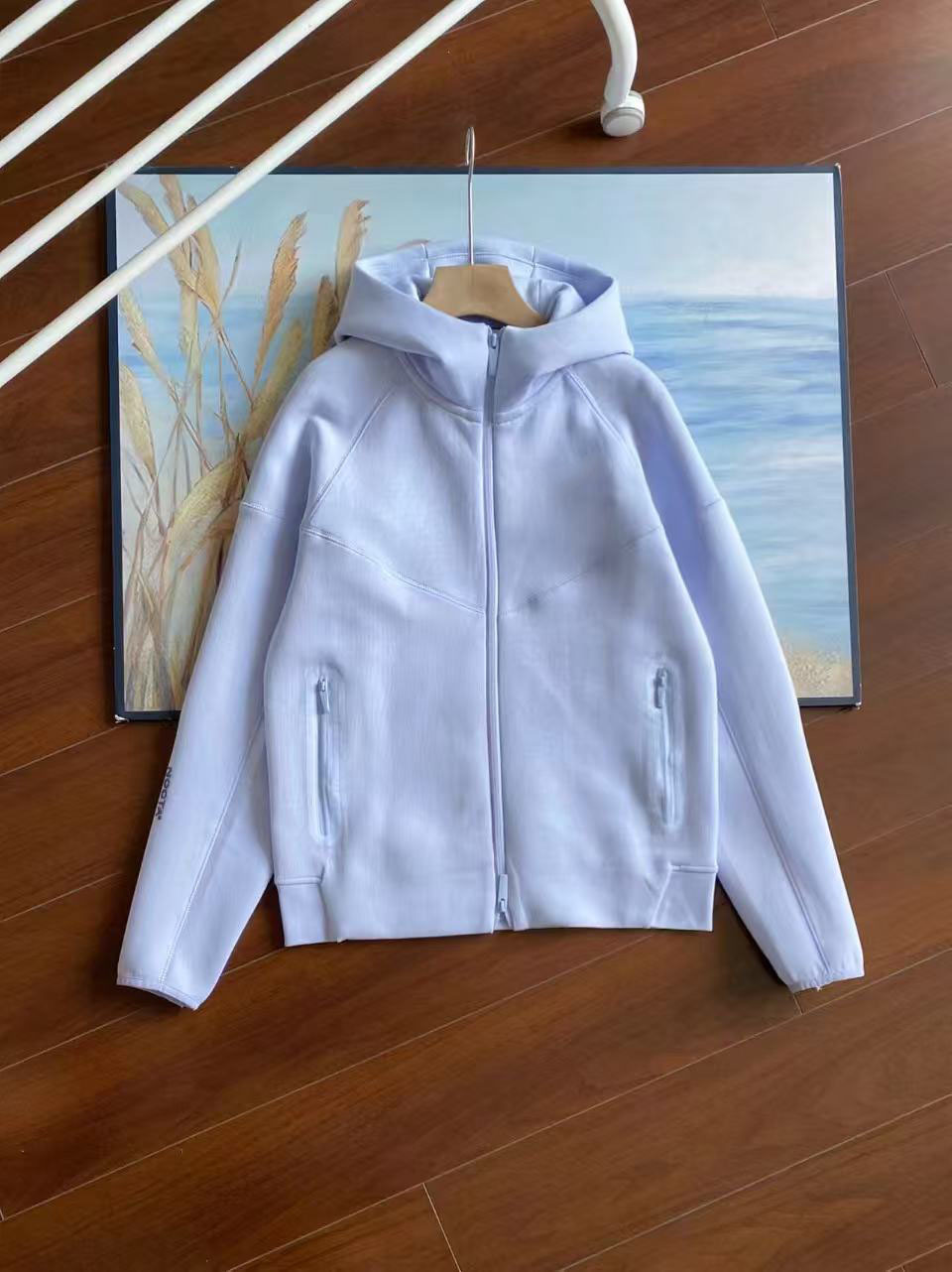 25 años primavera y otoño nuevo estilo casual deportes capa de aire chaqueta con capucha y pantalones trajes 454 y 461