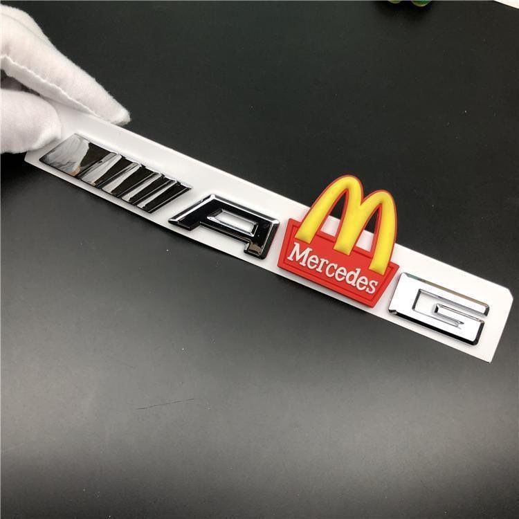 Mercedes-Benz C-Class, E-Class, and S-Class modified with AMG emblems, McDonald's car logos, BMW M logos, and new AMG tail emblems with black lettering