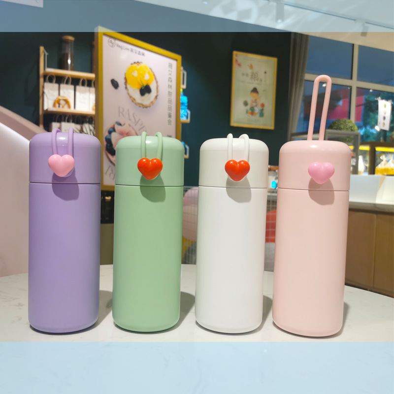 Taza con aislamiento al vacío de corazón estilo pareja creativa, mango de silicona portátil, bonita taza de agua de acero inoxidable 304 para estudiante