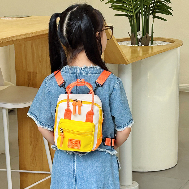 Nuevo mini mochila infantil multifuncional al aire libre bebé mochila de moda de color contraste bolso de hombro para hombres y mujeres
